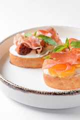 Juicy tomatoes and fresh fruit with carpaccio meat on fresh bread, sauce as topping. Traditional...