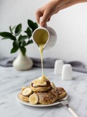 Cottage cheese pancakes with condensed milk.