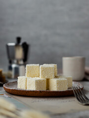 Homemade sweets, Sufi pigeon milk with coconut, marshmallows on a plate.