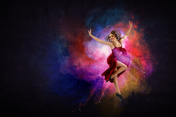 Fototapeta na wymiar Female dancer against colourful background
