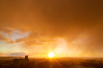 
Sunset sun after rain in orange light