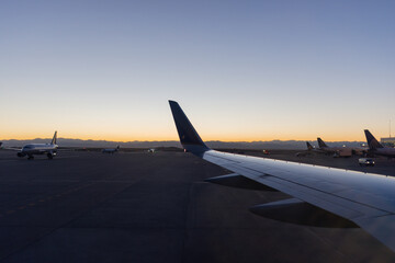 Fototapeta na wymiar Beautiful dark blue sky over parked planes at the airport