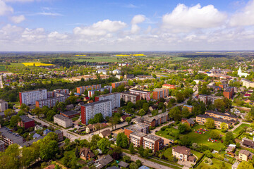 Fototapeta na wymiar view from above of the Dobele city, Industrial and residential buildings, streets and parks, Latvia