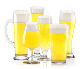Set of fresh light beer glasses with bubble froth isolated on white background.