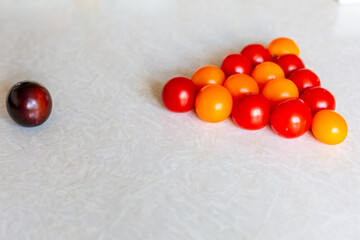 juicy tomatoes in the kitchen of different colors