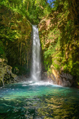 Fototapeta na wymiar Rain Forest Blue Waterfall in Costa Rica