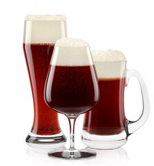 Set of fresh stout beer glasses with bubble froth isolated on white background.