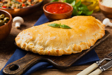 Italian calzone with mushrooms and ham.