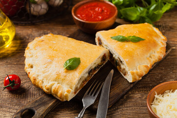 Italian calzone with mushrooms and ham.