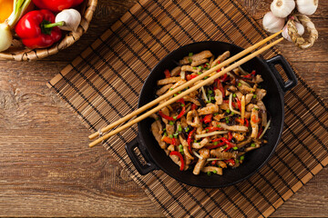 Pork chop with peppers, mushrooms and bamboo. Served with rice.