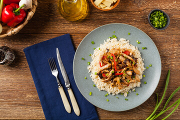 Pork chop with peppers, mushrooms and bamboo. Served with rice.