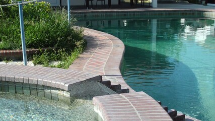 3D illustration - Swimming Pool with clear turquoise water and stairs underwater