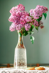 lilac in a glass vase in the interior