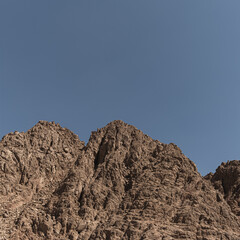 Picturesque view on sandstone mountain in desert with blue sky. Landscape with top of the high hill