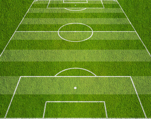 Obraz premium Soccer play field ground lines on sunny grass pattern background. Goal side perspective used.