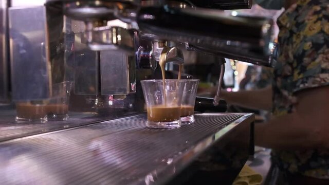 slow motion clip of a coffee machine working in a restaurant