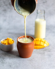 Mango lassi pouring shot - Punjabi drink lassi