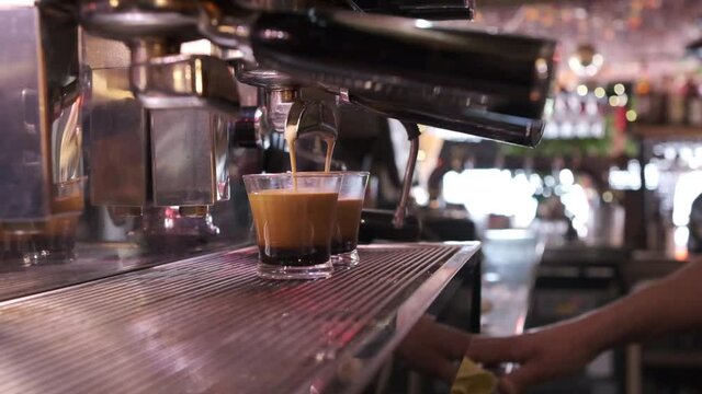 slow motion clip of a coffee machine working in a restaurant