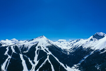 Balkans, Todorka mountain peak, ski tracks, covered with snow. Beautiful alpine natural winter backdrop. Pirin ice top of the hill on the blue sky background. 