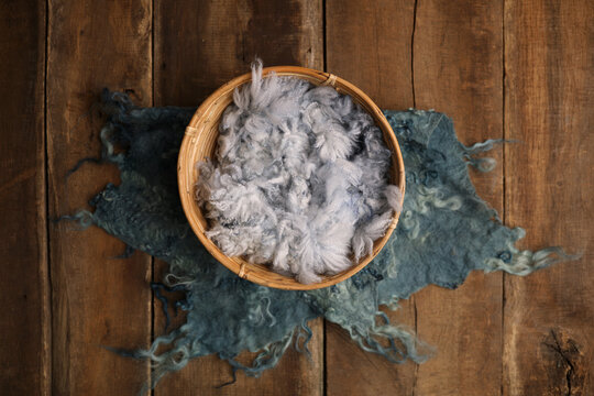 Newborn photography digital background prop. Wood basket with fur and on a wooden background