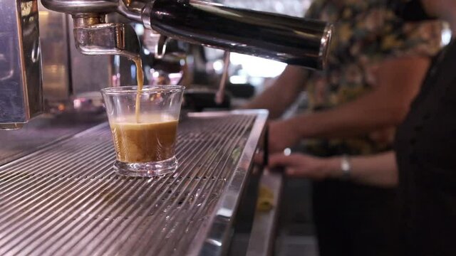 slow motion clip of a coffee machine working in a restaurant