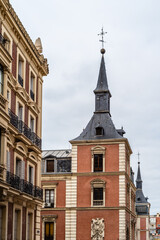 Tower in the Hall of Realms or Salon de Reinos of Madrid, originally a wing of the Buen Retiro Palace. Vertical shot a cloudy day.