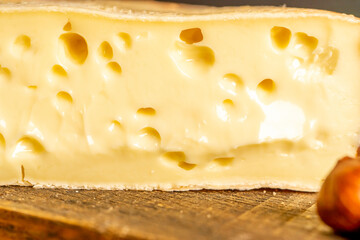 French cheese Saint Nectaire rustic collection delicious. Soft focus