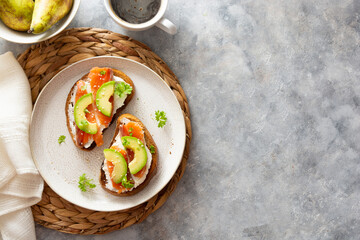 Healthy food, avocado and red fish salmon toast sandwich for breakfast or keto dieting, copy space