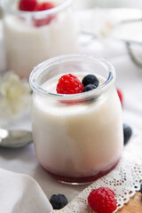 yogurt with raspberries in glass jars