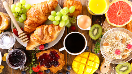 breakfast with coffee cup with croissants and fruits
