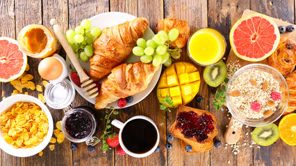 breakfast with coffee cup with croissants and fruits