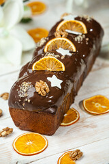 Panettone is the traditional Italian dessert for easter in 2021. Homemade panettone covered in chocolate. Sweet Bread served as dessert.