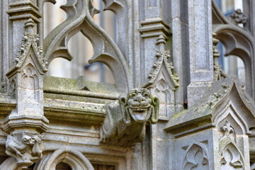Close-up on statues and ornaments (Dutch Gothic architecture) on the external facade of St Janskathedraal (St John's Cathedral), located in the historical center of Hertogenbosch, Netherlands