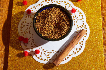 Loose instant coffee in blue beautiful ceramic saucer. A resource for making a delicious coffee drink