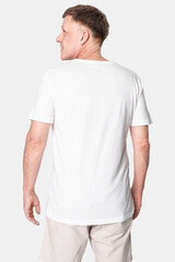 Man wearing minimal white t-shirt rear view