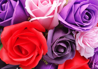 a close-up with artificial multicolored roses
