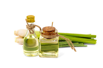 lemongrass oil In a transparent bottle,  fresh lemongrass placed separately isolated on white background