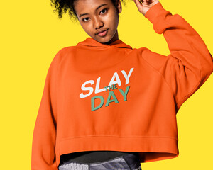 Girl in an orange hoodie winter youth apparel shoot