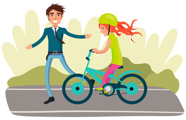 Man in business suit teaches daughter to ride bike for first time. Dad helping girl kid riding bicycle. Parenting, fatherhood concept. Parent actively spends time with child. Family walk in park