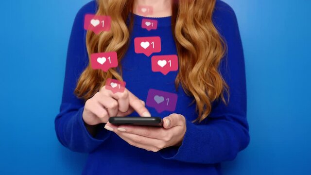 Young girl receive likes using phone social media network application. Animation like icons. Social, love, success, influencer concept animation on blue background