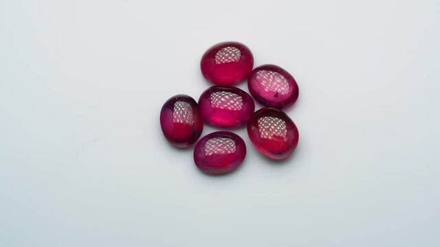 natural red rhodolite gemstone on the turning table