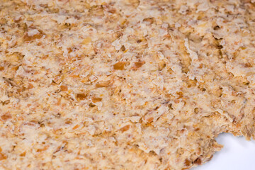 Flat rye-wheat crispbread, fragment close-up in selective focus