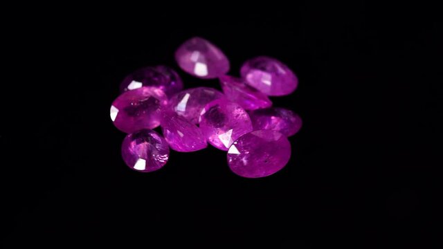natural red rhodolite gemstone on the turning table