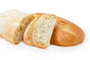 Partly sliced ciabatta against wheat bread on white background