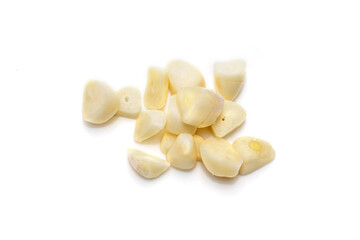 Fototapeta na wymiar Sliced garlic cloves on a white background. Chopped garlic isolated on a white background.