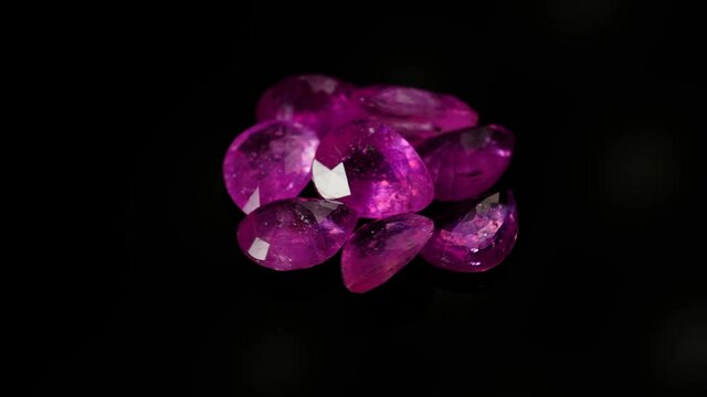 natural red rhodolite gemstone on the turning table