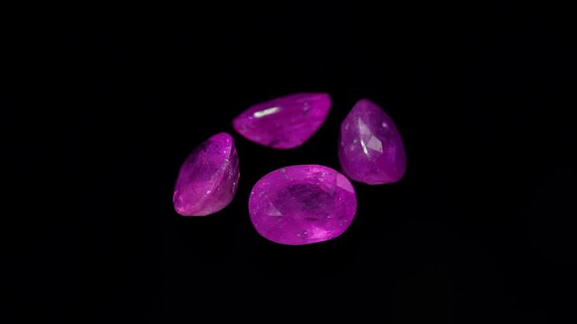 natural red rhodolite gemstone on the turning table