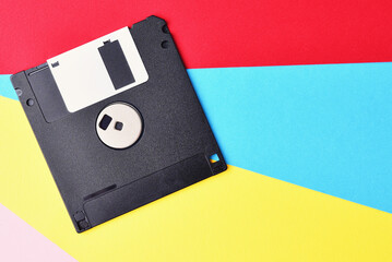 Floppy disk on colorful background