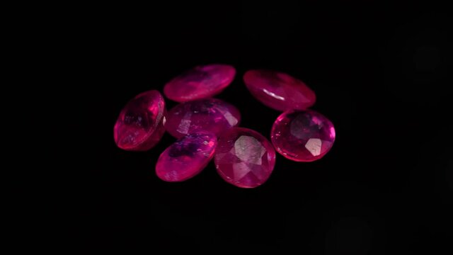 natural red rhodolite gemstone on the turning table