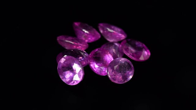 natural red rhodolite gemstone on the turning table